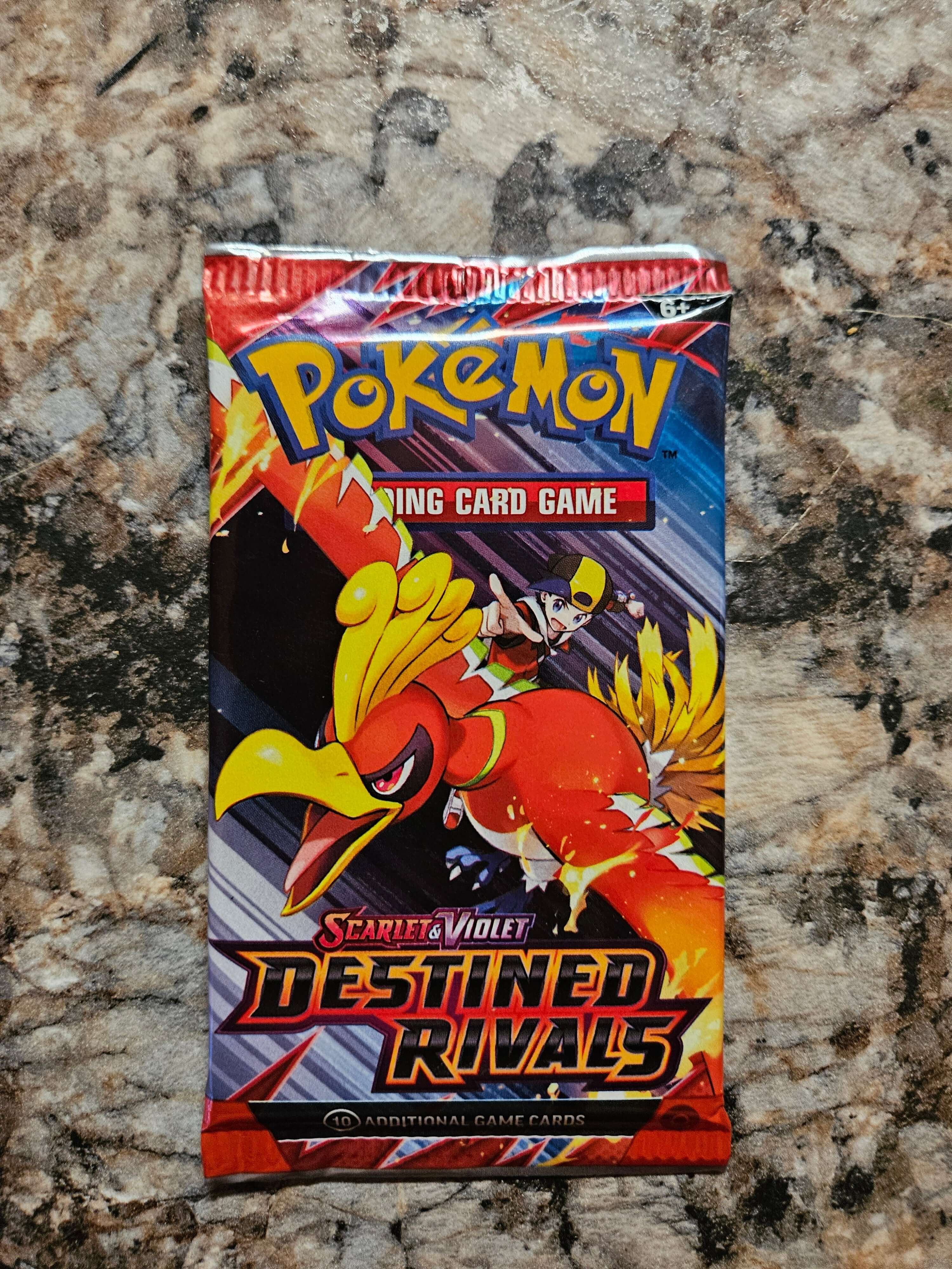 Pokemon Destined Rivals Booster Pack featuring Ho-Oh from the Pokemon TCG series.