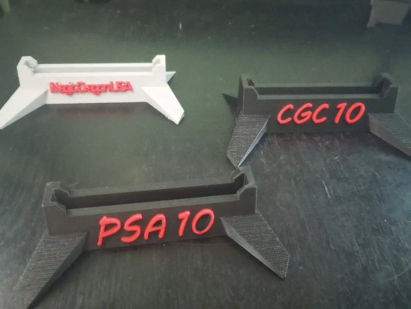 Customizable Trading Card Display Stand featuring holders for PSA 10 and CGC 10 with customizable lettering options.