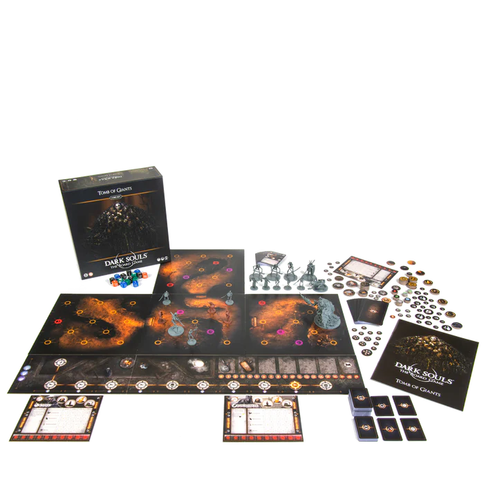 Unboxed contents of Dark Souls: Tomb of Giants board game including miniatures, cards, tiles, and player boards