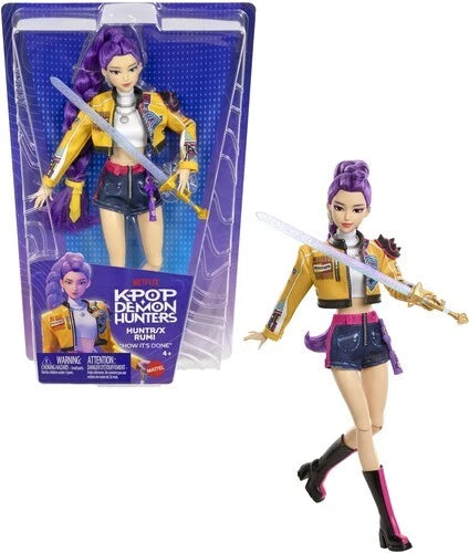 KPop Demon Hunters fashion dolls featuring Rumi with sword in stylish outfit and packaging.